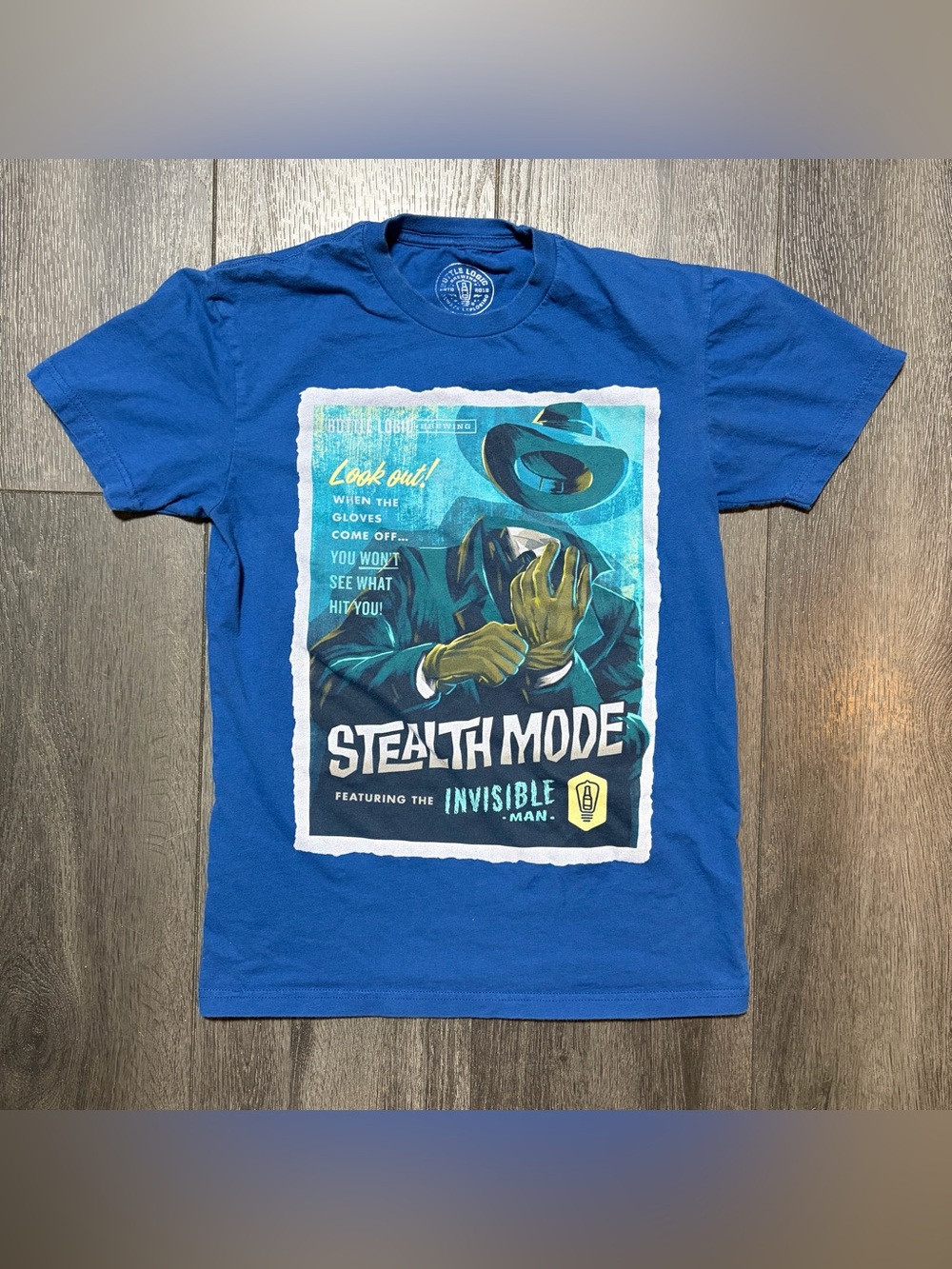 Bottle Logic Brewing Stealth Mode Invisible Man T-Shirt Blue Women’s Size Small